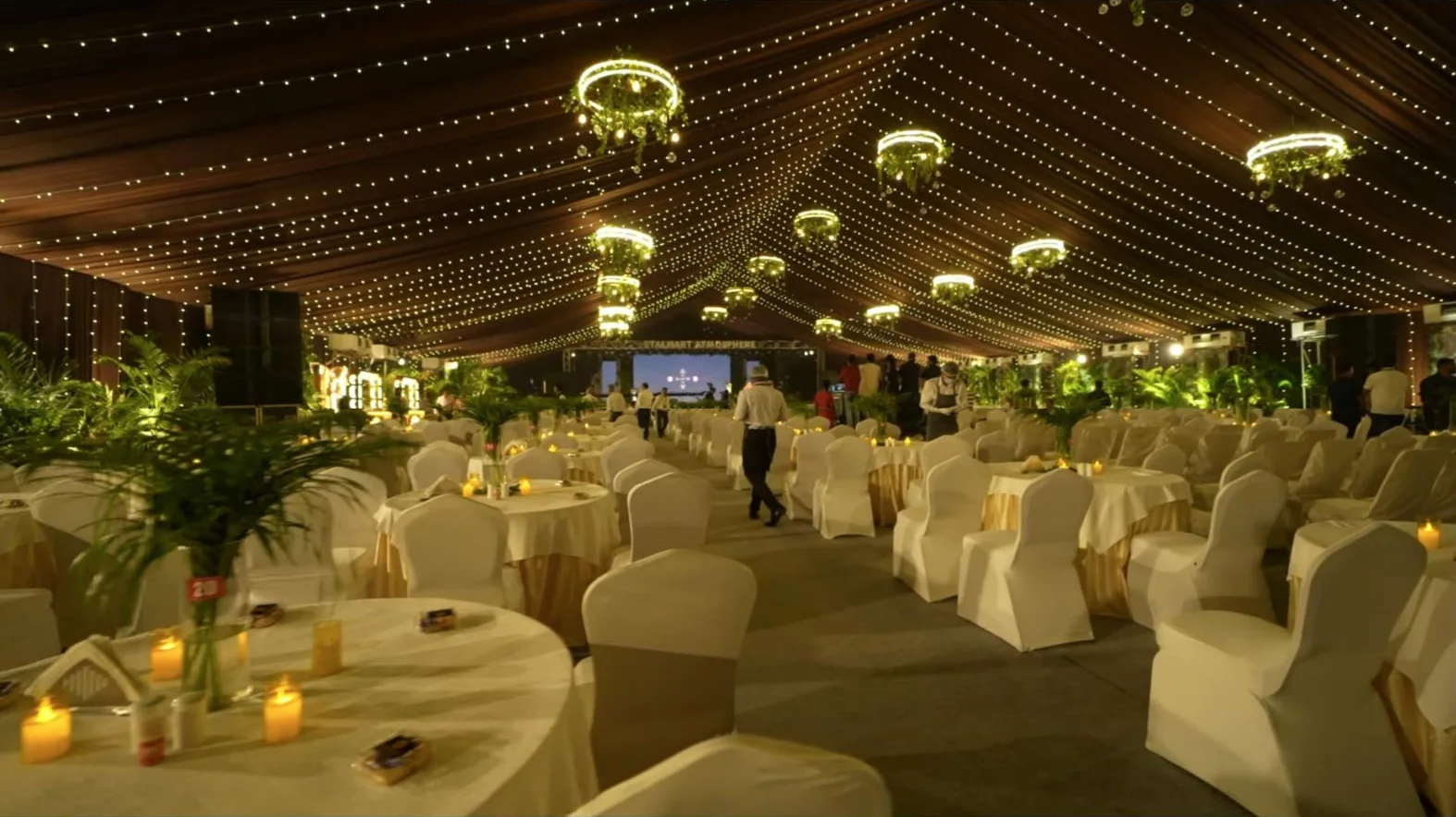 The pavilion set for the evening under string lights